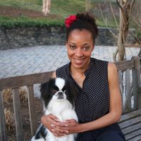 Dr. Nia Perkins with Japanese Chin Miles Davis