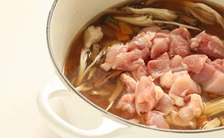 Chicken broth preparation on stove